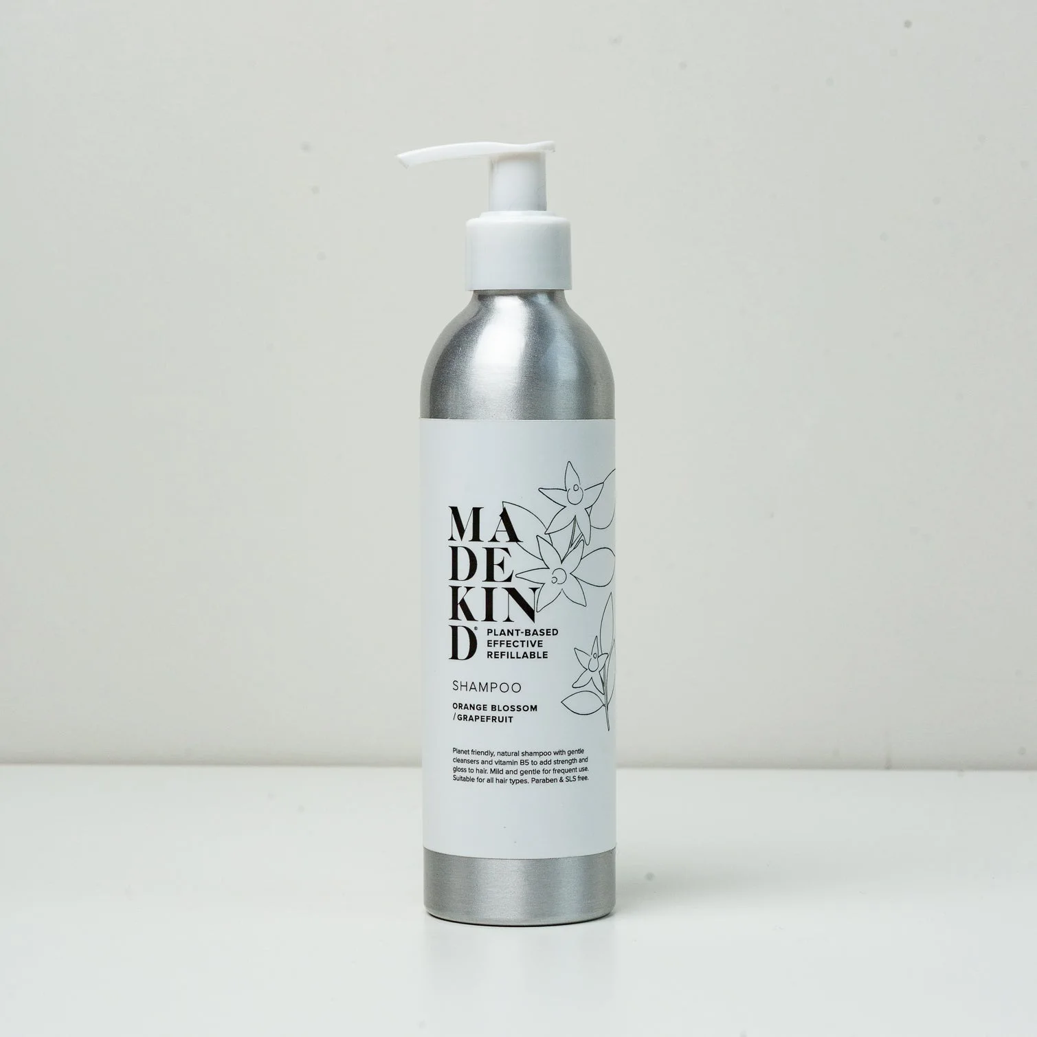 Photo of MadeKind's natural shampoo in an aluminium bottle
